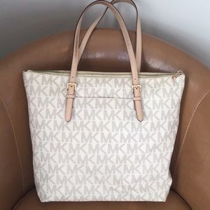 Michael Kors coated canvas top zipper tote.
